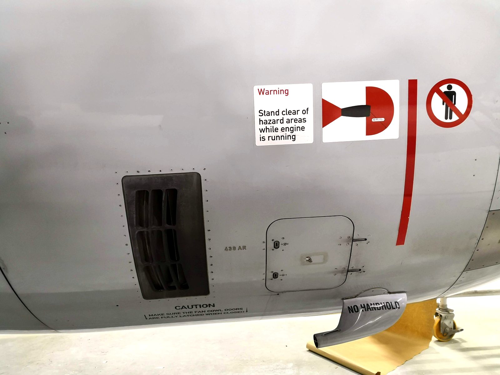 Warning and hazard-area markings applied on an A320 engine cowling