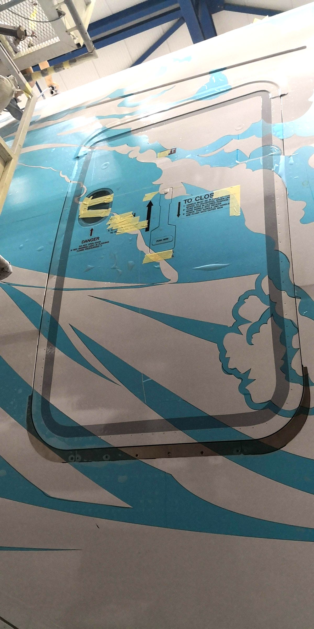A380 passenger door with livery graphics and door markings